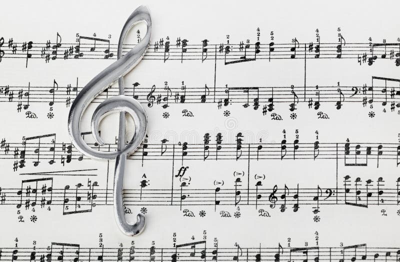 Treble clef on music sheet - musical background. Treble clef on music sheet - musical art background royalty free stock photo Treble clef on music sheet - musical background. Treble clef on music sheet - musical art background royalty free stock photo