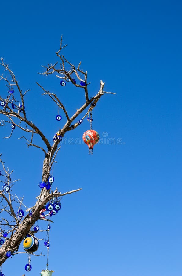 A tree decorated with many Nazar Boncuk in Cappadocia : r