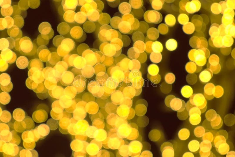 Tree branches wrapped in festive lights. Christmas street lights. Close-up view, blur background. royalty free stock image Tree branches wrapped in festive lights. Christmas street lights. Close-up view, blur background. royalty free stock image