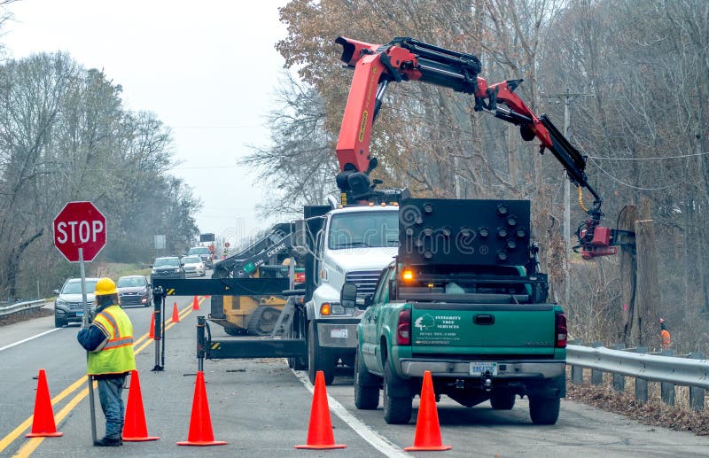 Tree crew works on side of a busy highway stock images Tree crew works on side of a busy highway stock images