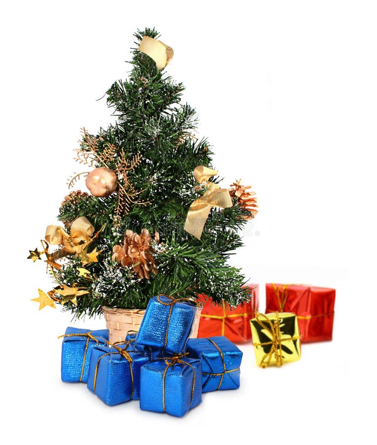 Christmas tree and gifts against white background, focus set in foreground. Christmas tree and gifts against white background, focus set in foreground