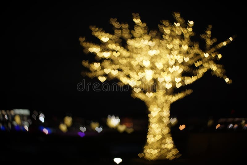 Tree of golden hearts lights. Beautiful valentines day background stock images
