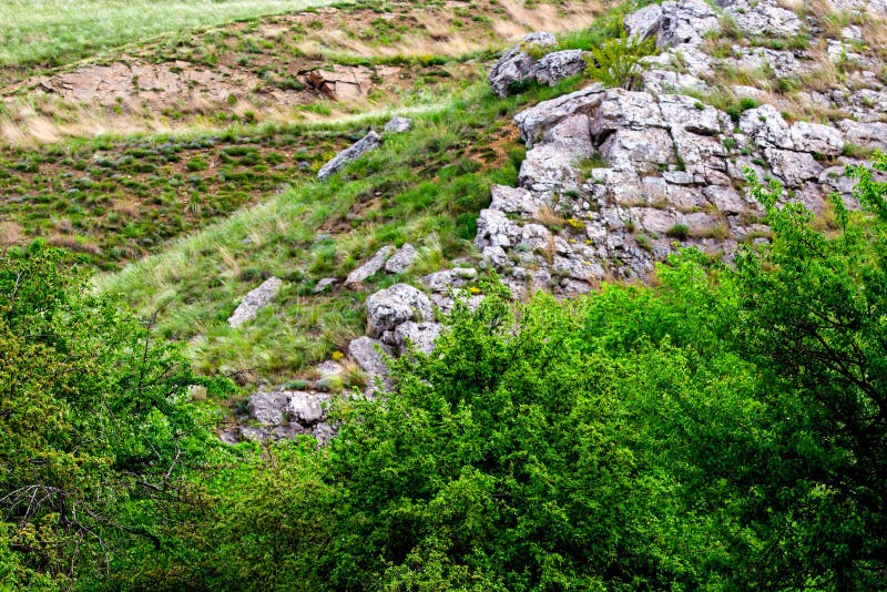 Edge Of Steep Slope On Rocky Hillside In Cloudy Weather. Dramatic Scenery  In Mountains Stock Photo, Picture and Royalty Free Image. Image 81704261.