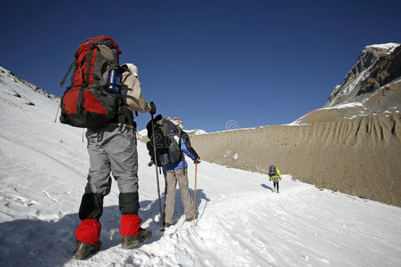 Trekkers following mountain path