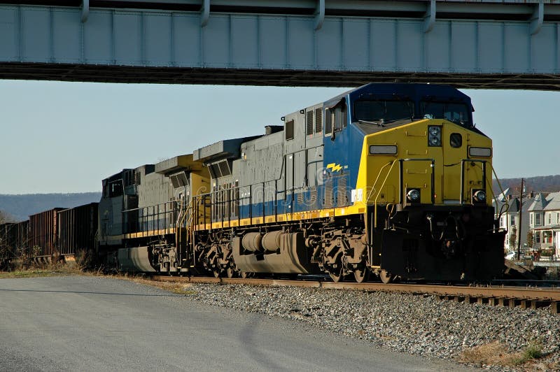 Freight train under a bridge waiting for clearance to proceed onto the main track. Freight train under a bridge waiting for clearance to proceed onto the main track.