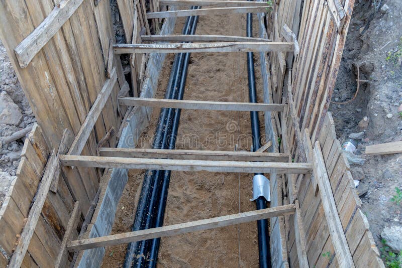 Trench with Electrical Cables. Laying the Cable Underground Stock Photo