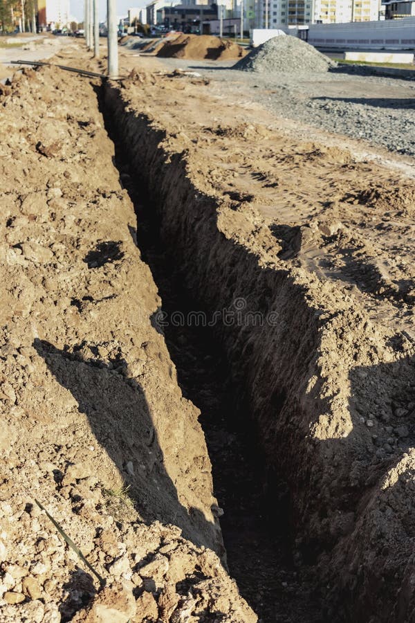 A Trench in the Ground Prepared for Laying the Electrical Cable at the