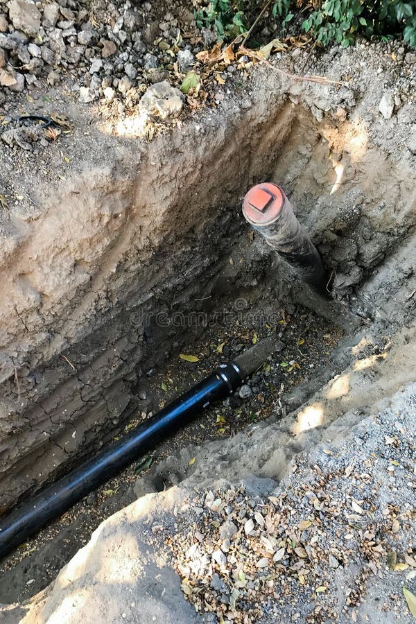 Trench with Plumbing Pipe and Clean Out Cap Stock Image Image of