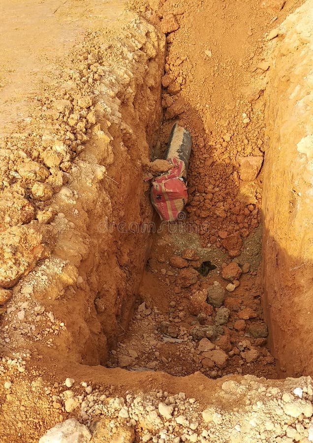 Trenches excavated at the construction site by construction workers to accommodate the utility services. royalty free stock images