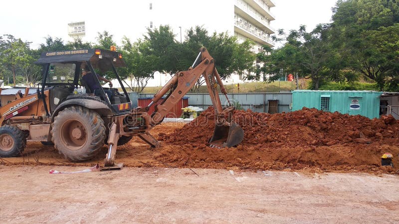 Trenches excavated at the construction site by construction workers to accommodate the utility services. stock photography