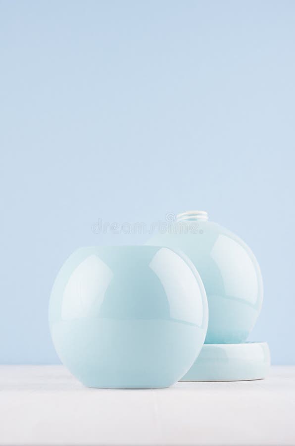 Trendy Color In Modern Interior Soft Pastel Light Blue trendy color modern interior soft pastel light blue smooth ceramic bowls vase white wood background