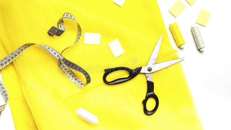 Seamstress using tape measure Stock Photo by ©tonodiaz 149437584