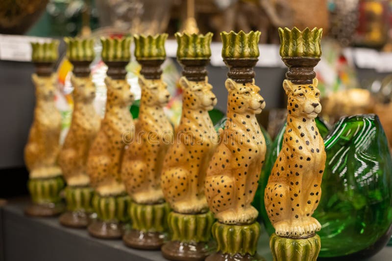 Trendy exotic animal shaped ceramic candlesticks, sconces, Arte Deco style home decoration concept, selective focus. Trendy exotic animal cheetah shaped ceramic stock photos Trendy exotic animal shaped ceramic candlesticks, sconces, Arte Deco style home decoration concept, selective focus. Trendy exotic animal cheetah shaped ceramic stock photos