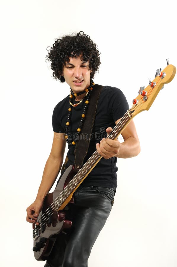 Trendy hispanic teen playing bass guitar