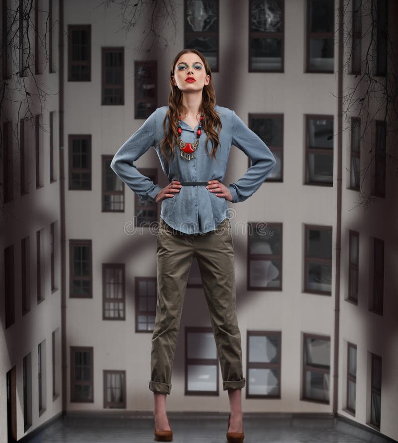 Trendy Woman posing in Pants and Blouse