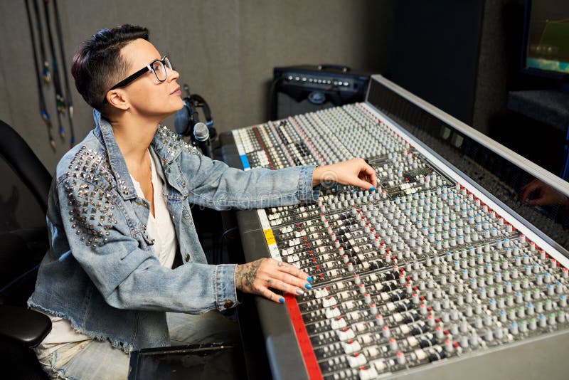 Trendy woman working with music console royalty free stock photos Trendy woman working with music console royalty free stock photos