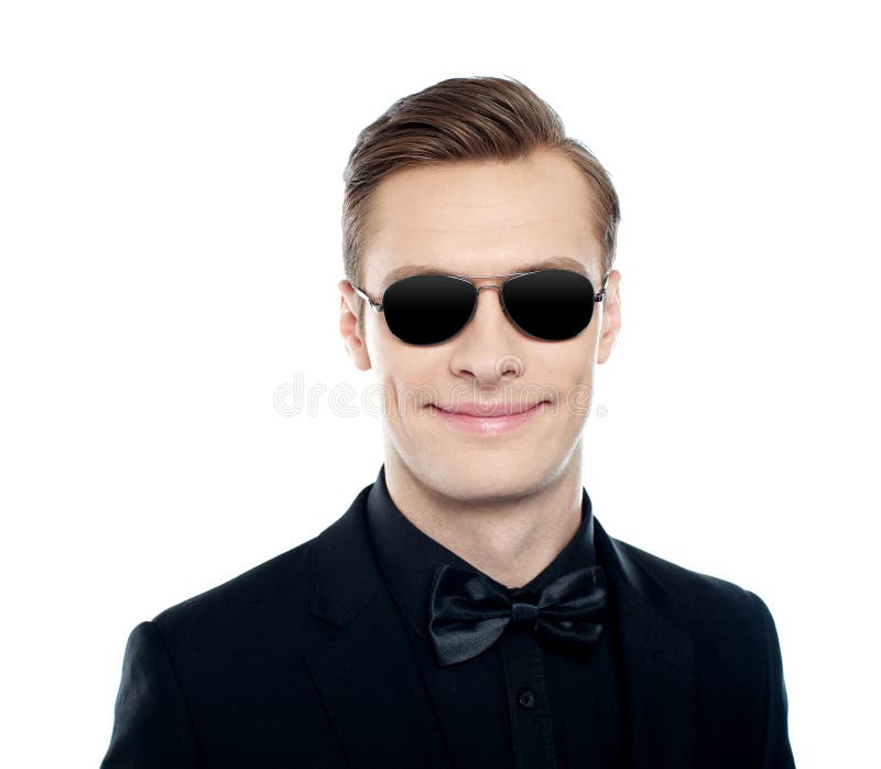 Trendy young male model wearing goggles stock images