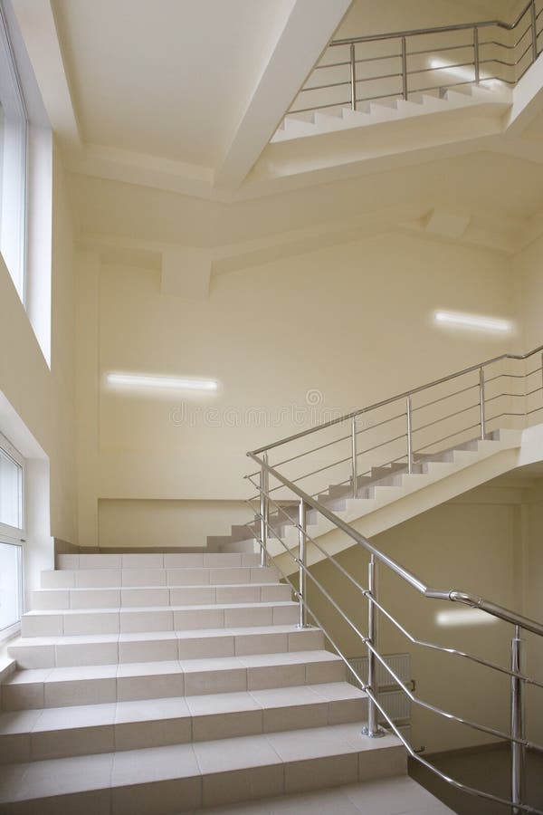 Stairway with metal handrails in the new modern building. Stairway with metal handrails in the new modern building