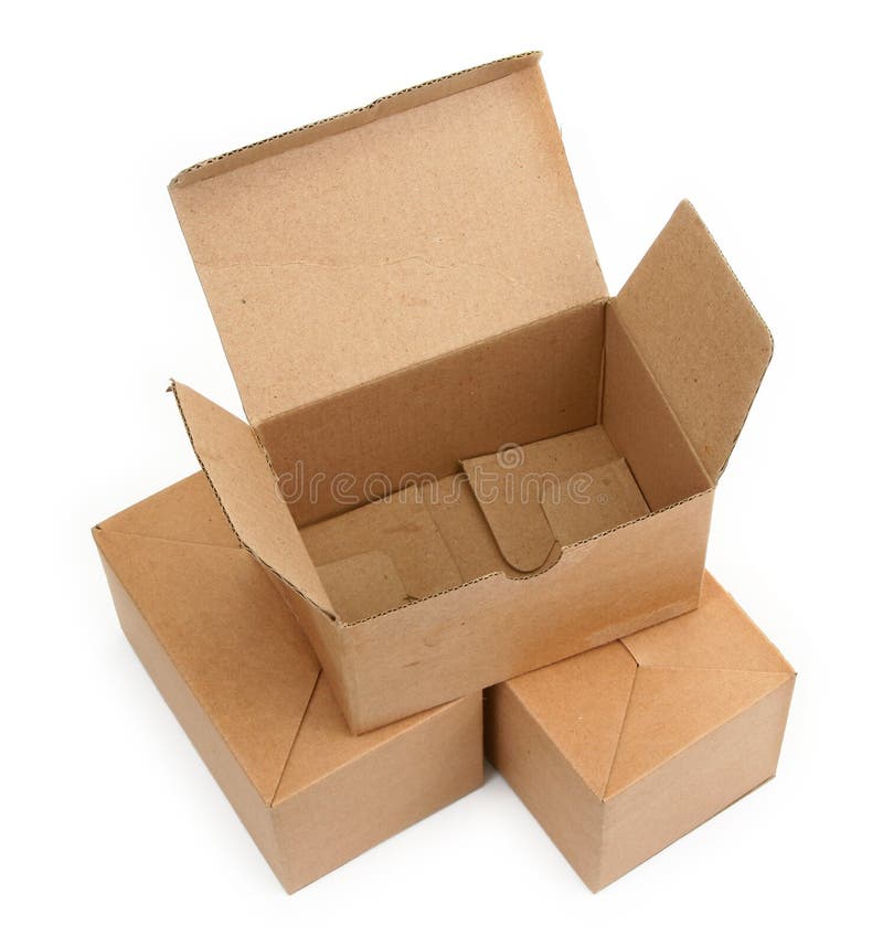 Close-up of three cardboard boxes againt white background, minimal shadow among. Close-up of three cardboard boxes againt white background, minimal shadow among