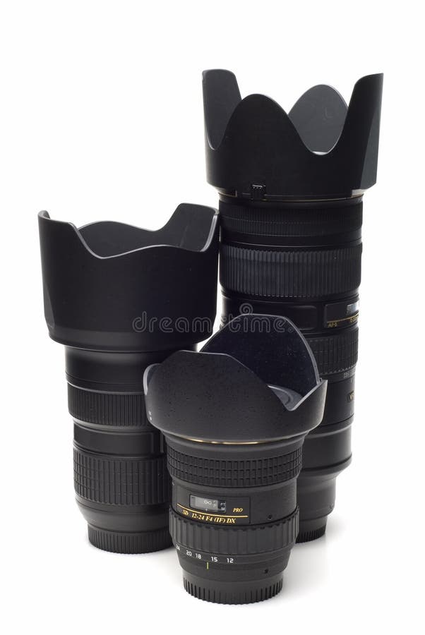 Some different lenses for reflex cameras isolated on a white background. Some different lenses for reflex cameras isolated on a white background.