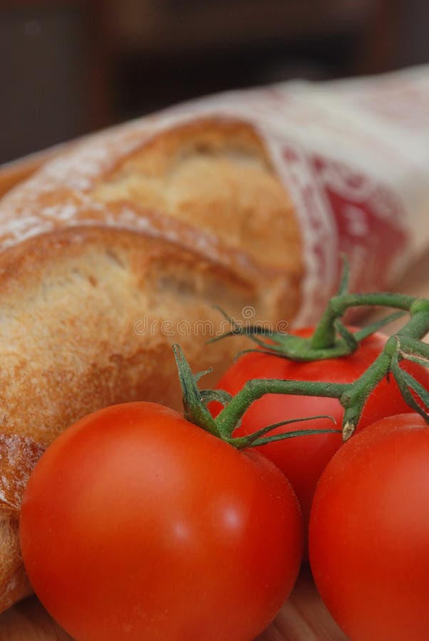 Vine tomatoes and French bread. Vine tomatoes and French bread