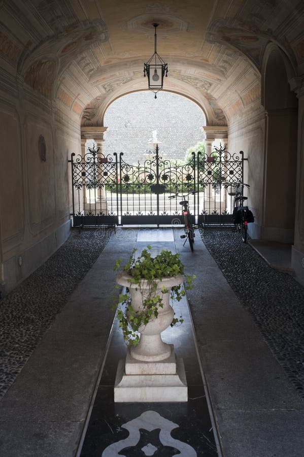 Treviglio (Italy), entrance of historic palace. Treviglio (Bergamo, Lombardy, Italy), entrance of historic palace with plants and two bicycles royalty free stock photos Treviglio (Italy), entrance of historic palace. Treviglio (Bergamo, Lombardy, Italy), entrance of historic palace with plants and two bicycles royalty free stock photos