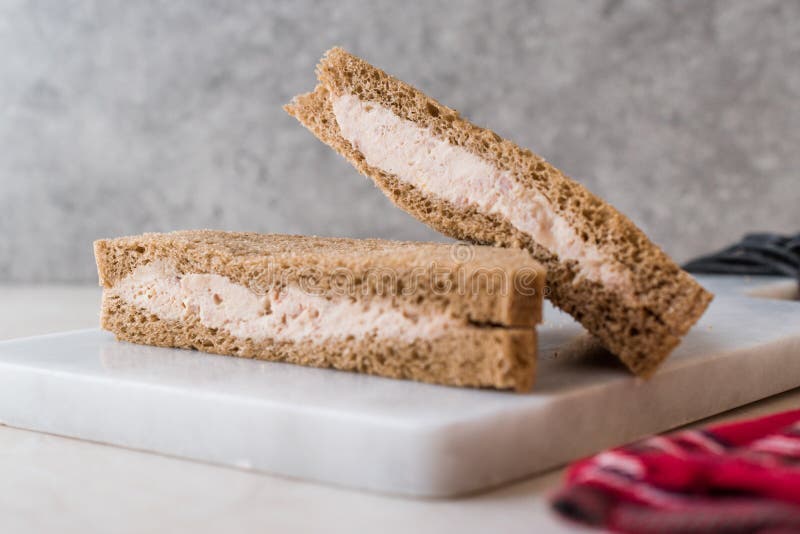 Triangle Light Sandwich with Tuna Fish Paste on Marble Board Stock