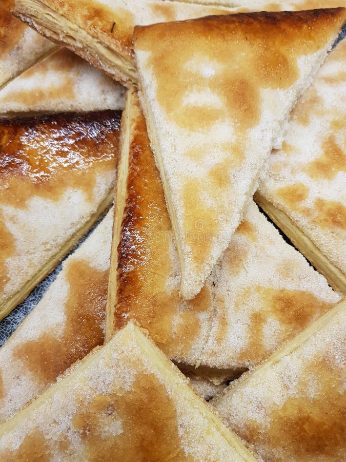 Triangle Shaped Slices Of Crispy, Sweet Bread In A Bakery Stock Photo