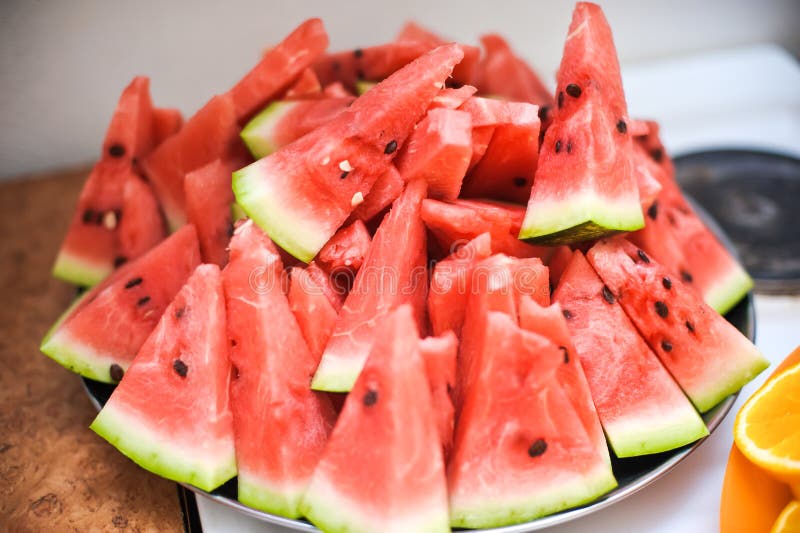 Triangular watermelon slices on a plate, detox concept. Triangular cut watermelon stock images, royalty-free photos and pictures