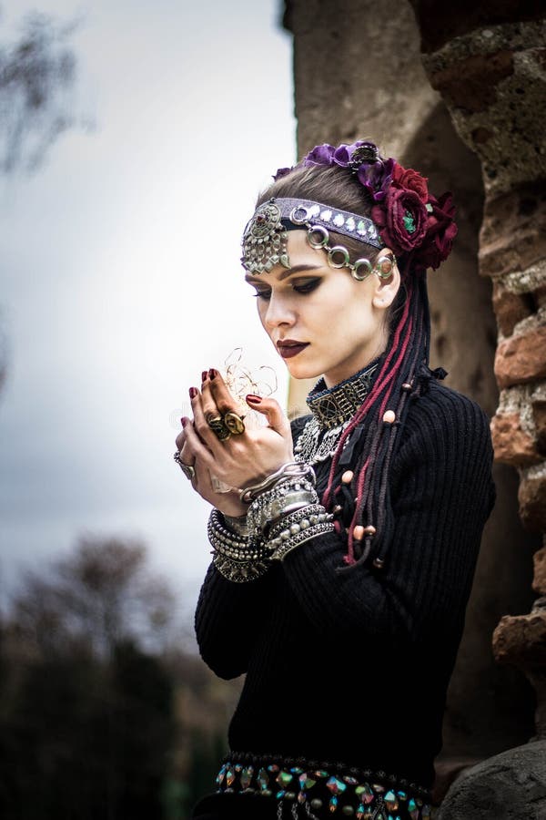 Tribal woman portrait outdoors in autumn trees