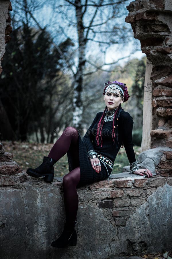 Tribal woman portrait outdoors in autumn trees