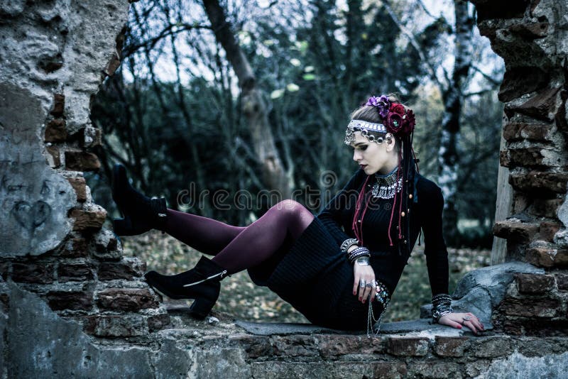 Tribal woman portrait outdoors in autumn trees