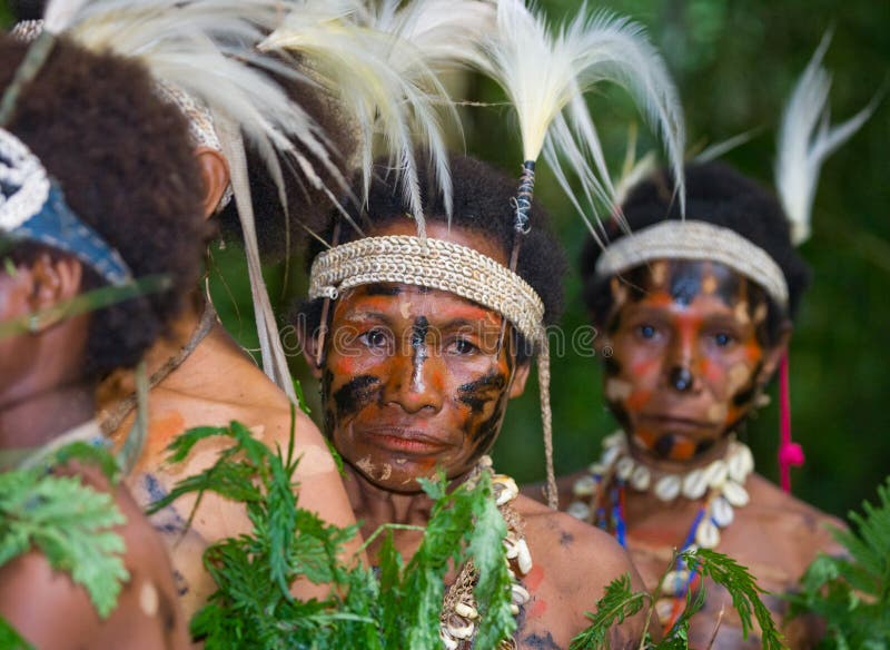 NEW GUINEA, INDONESIA - 13 JANUARY: Women Yaffi tribe in traditional coloring. New Guinea Island, Indonesia. January 13, 2009. NEW GUINEA, INDONESIA - 13 JANUARY: Women Yaffi tribe in traditional coloring. New Guinea Island, Indonesia. January 13, 2009.