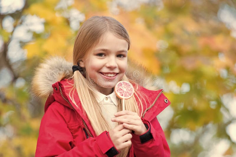Trick or treat sweet candy. Sweet candy her trophy on halloween day. Kid girl wear coat for fall season. Child cheerful royalty free stock photography Trick or treat sweet candy. Sweet candy her trophy on halloween day. Kid girl wear coat for fall season. Child cheerful royalty free stock photography