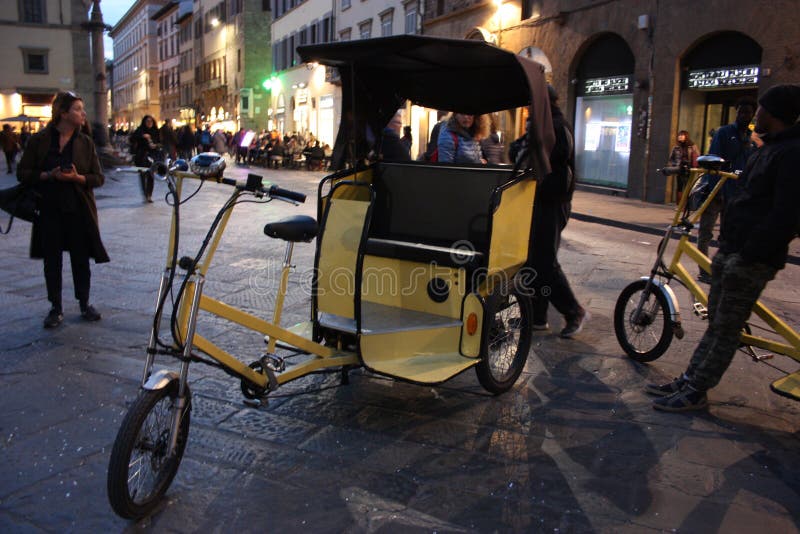 Tricycle for tourist transport in Florence in Piazza della Duomo stock image Tricycle for tourist transport in Florence in Piazza della Duomo stock image