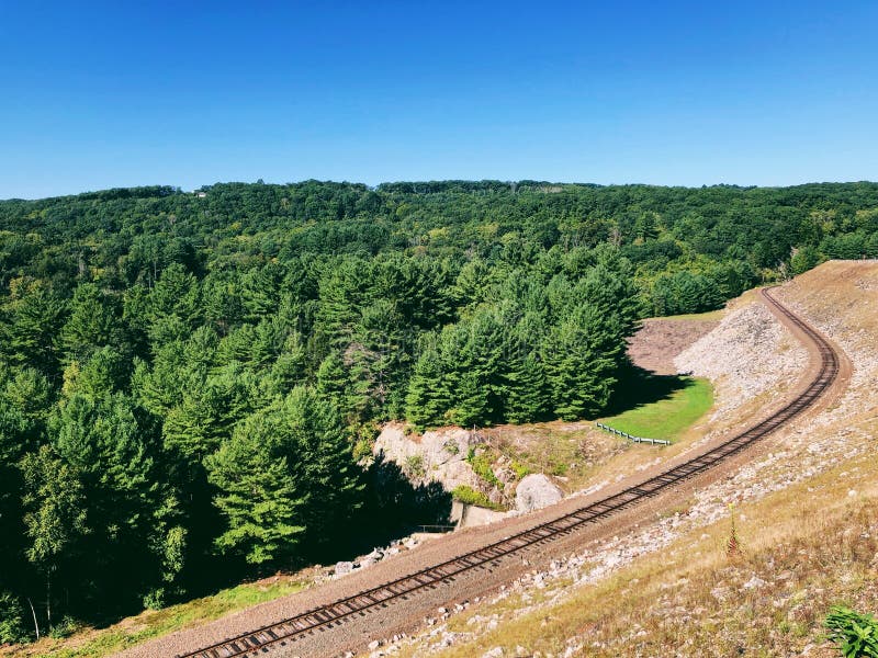 The railroad track of Thomaston Dam and portions of the Naugatuck River Valley located on the scenic Naugatuck River in Thomaston Town Connecticut United States. The railroad track of Thomaston Dam and portions of the Naugatuck River Valley located on the scenic Naugatuck River in Thomaston Town Connecticut United States.