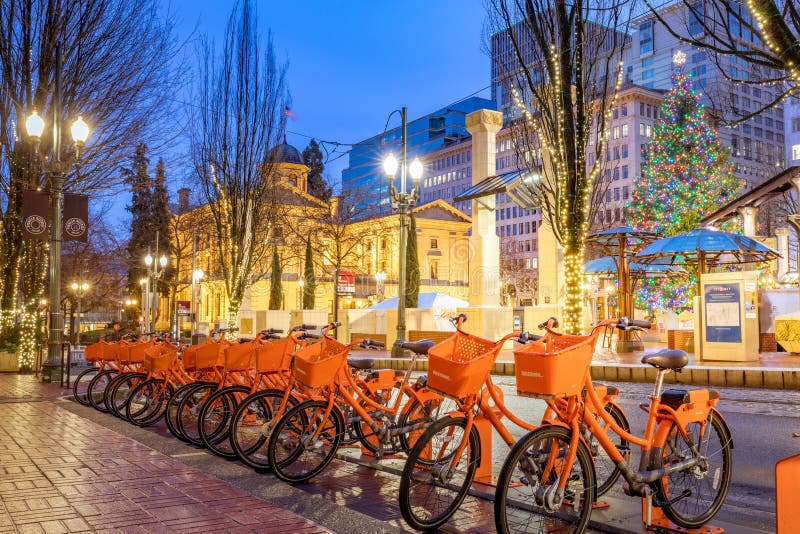 Portland, Oregon, United States - Dec 24, 2017 : Nike Biketown bicycles renting station at night behind Pioneer square in Morrison St, Downtown Portland. Portland, Oregon, United States - Dec 24, 2017 : Nike Biketown bicycles renting station at night behind Pioneer square in Morrison St, Downtown Portland