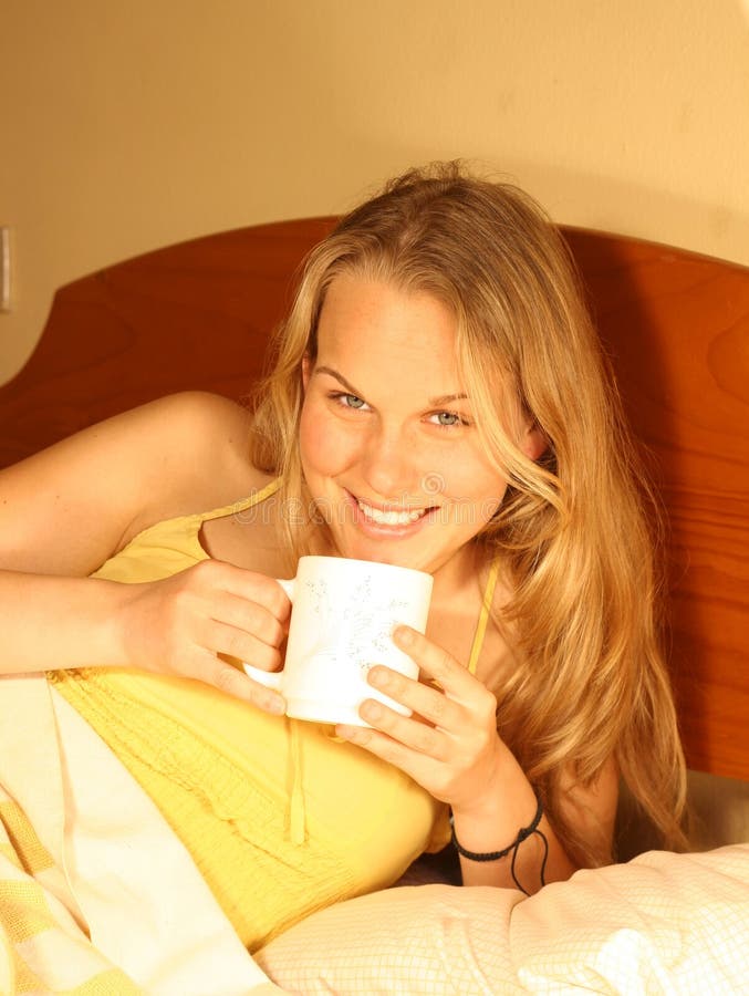 Young happy smiling woman drinking coffee. Young happy smiling woman drinking coffee
