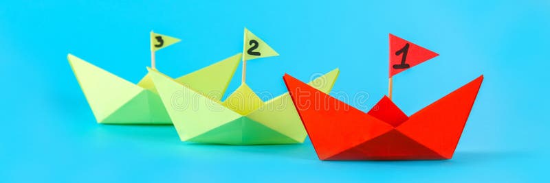 Three paper ships compete who swims faster. Red wins the ship. Three paper ships compete who swims faster. Red wins the ship.