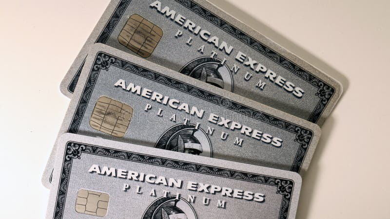 Three American Express Amex Platinum cards stacked on a white table. Symbols of wealthy, rich and luxurious lifestyle with a lot of benefits and travels. Photographed in Espoo, Finland May 2019. Three American Express Amex Platinum cards stacked on a white table. Symbols of wealthy, rich and luxurious lifestyle with a lot of benefits and travels. Photographed in Espoo, Finland May 2019.