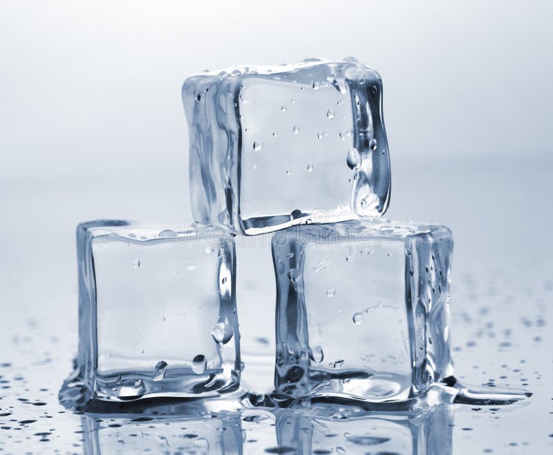 Three ice cubes on glass table. Three ice cubes on glass table