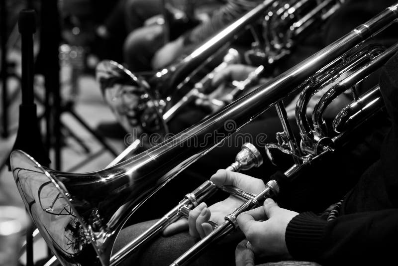 Trombones in the Hands of the Musicians Stock Image Image of band