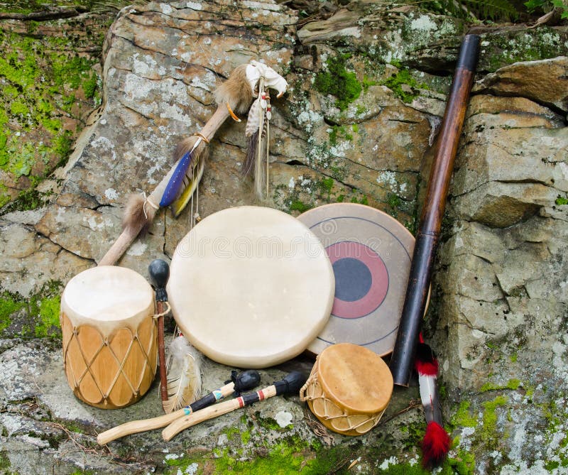 A Collection Native American Drums with Beaters, Rain Stick and Spirit Chaser. A Collection Native American Drums with Beaters, Rain Stick and Spirit Chaser.