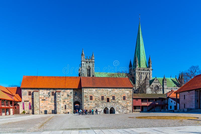 TRONDHEIM, NORWAY, APRIL 17, 2019: Nidaros cathedral viewed from courtyard of archbishop\'s palace in Trondheim, Norway. TRONDHEIM, NORWAY, APRIL 17, 2019: Nidaros cathedral viewed from courtyard of archbishop\'s palace in Trondheim, Norway