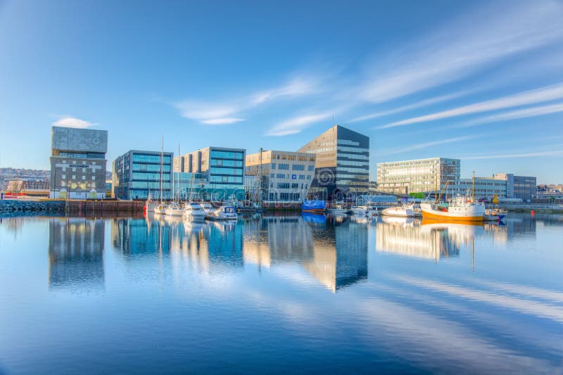 TRONDHEIM, NORWAY, APRIL 17, 2019: Marina in Trondheim with Rockheim museum of rock music, Norway. TRONDHEIM, NORWAY, APRIL 17, 2019: Marina in Trondheim with Rockheim museum of rock music, Norway