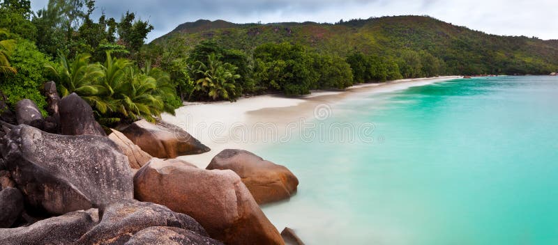 Panoramic view of a tropical beach at dawn. Anse Lazio, Praslin island, Seychelles, Indian Ocean.