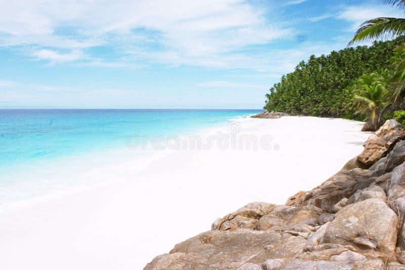 A beautiful white-sand beach on the exlusive Seychelles holiday island of Fregate. Seychelles stock images, royalty-free photos and pictures