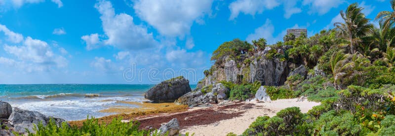 Tropical beach and ancient mayan ruins on a cliff at Tulum. In the Mayan Riviera, Mexico, aboriginal, aborigine, america, american, antique, archaeology, archeology, architecture, attraction, building, cancun, caribbean, castle, city, civilization, culture, destination, heritage, historic, historical, history, holiday, indian, landmark, mexican, monument, ocean, old, pre-hispanic, quintana, roo, rock, sea, summer, temple, tourism, tourist, town, travel, vacation, yucatan