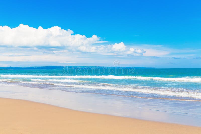 Tropical beach and beautiful sea. Blue sky with clouds in the ba