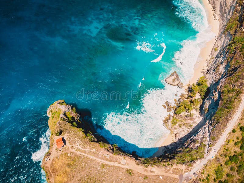 Tropical Beach with Blue Ocean and Rocky Cliff in Nusa Penida. Aerial
